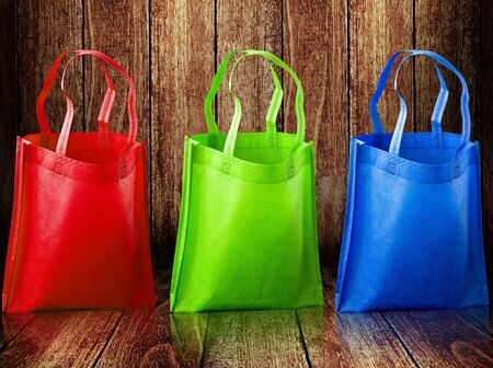 Shopping bag on wooden backgroundの写真素材
