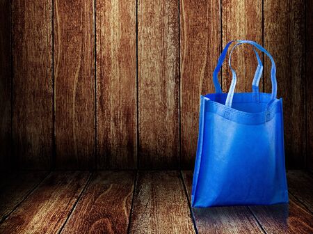 Shopping bag on wooden backgroundの写真素材