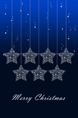 Hanging Christmas star with snow backgroundの写真素材