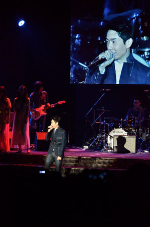 BANGKOK, THAILAND  NOV 18 : Boy Peacemaker or Anuwat Sanguansakphakdee Christian singer singing and show in Crossover Live  Concert on 18 November 2012 at Bangkok Christian College, Bangkok, Thailandのeditorial素材