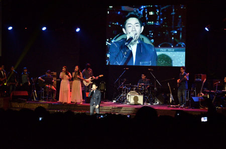 BANGKOK, THAILAND  NOV 18 : Boy Peacemaker or Anuwat Sanguansakphakdee Christian singer singing and show in Crossover Live  Concert on 18 November 2012 at Bangkok Christian College, Bangkok, Thailandのeditorial素材