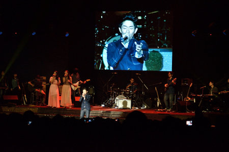 BANGKOK, THAILAND  NOV 18 : Boy Peacemaker or Anuwat Sanguansakphakdee Christian singer singing and show in Crossover Live  Concert on 18 November 2012 at Bangkok Christian College, Bangkok, Thailandのeditorial素材