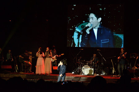 BANGKOK, THAILAND  NOV 18 : Boy Peacemaker or Anuwat Sanguansakphakdee Christian singer singing and show in Crossover Live  Concert on 18 November 2012 at Bangkok Christian College, Bangkok, Thailandのeditorial素材