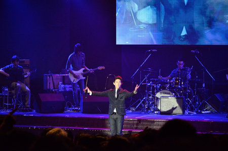 BANGKOK, THAILAND  NOV 18 : Boy Peacemaker or Anuwat Sanguansakphakdee Christian singer singing and show in Crossover Live  Concert on 18 November 2012 at Bangkok Christian College, Bangkok, Thailandのeditorial素材