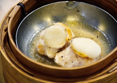 Chinese steamed dimsum in bamboo containers traditional cuisine の写真素材