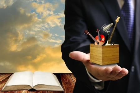 Music college examination concept, Music instrument box in the teacher handの写真素材