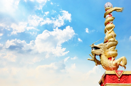 Dragon statue roll the column with nice sky backgroundの写真素材