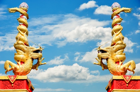 Dragon statue roll the column with nice sky backgroundの写真素材