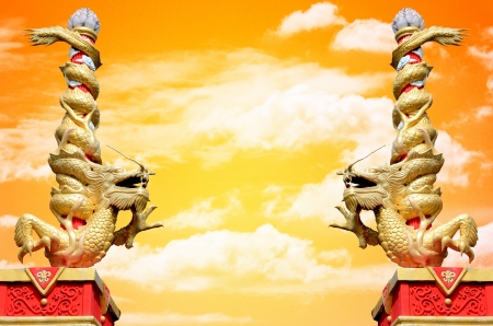 Dragon statue roll the column with sunset sky backgroundの写真素材