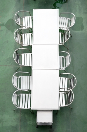 Top view of Metal table and chair with wet floor の写真素材