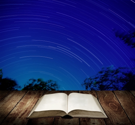 Reading book with star trails background, Education conceptの写真素材