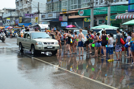 CHIANG MAI, THAILAND - APRIL 12 : Tourists celebrating Songkran (Thai new year / water festival) in the streets by throwing water at each other on 12 April 2013 in Chiang Mai, Thailandのeditorial素材