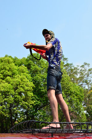 CHIANG MAI, THAILAND - APRIL 13 : Tourist stand on bus for celebrating Songkran (Thai new year / water festival) on 13 April 2013 in Chiang Mai, Thailandのeditorial素材