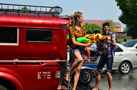 CHIANG MAI, THAILAND - APRIL 13 : Tourist stand on bus for celebrating Songkran (Thai new year / water festival) on 13 April 2013 in Chiang Mai, Thailandのeditorial素材