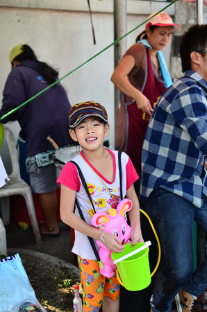 CHIANG MAI, THAILAND - APRIL 13 : Young people celebrating Songkran (Thai new year / water festival) in the streets by throwing water at each other on 13 April 2013 in Chiang Mai, Thailandのeditorial素材