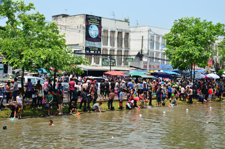 CHIANG MAI, THAILAND - APRIL 13   People celebrating Songkran  Thai new year   water festival  in the streets by throwing water at each other on 13 April 2013 in Chiang Mai, Thailandのeditorial素材
