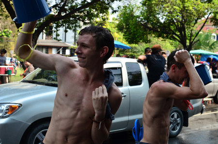 CHIANG MAI, THAILAND - APRIL 13 : Tourists celebrating Songkran (Thai new year / water festival) in the streets on 13 April 2013 in Chiang Mai, Thailandのeditorial素材