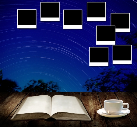 Read astronomy book and photo frame post on wallの写真素材