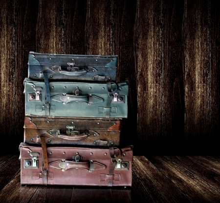 Vintage old leather luggage display in wooden shelf の写真素材