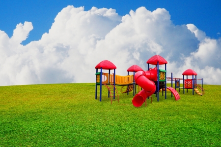 Colorful children s playground in garden with nice sky backgroundの写真素材