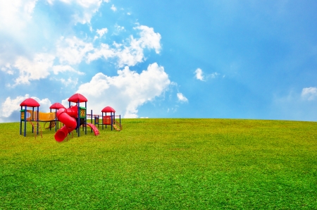 Colorful children s playground in garden with nice sky backgroundの写真素材