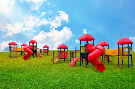Colorful children s playground in garden with nice sky backgroundの写真素材