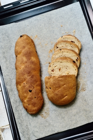 Homemade raisin bread in trayの写真素材