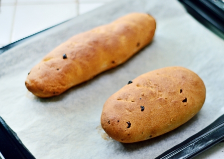 Homemade raisin bread in trayの写真素材