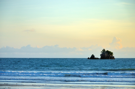 Island in the sea with cloudy sky background in Ranong, Thailandの写真素材