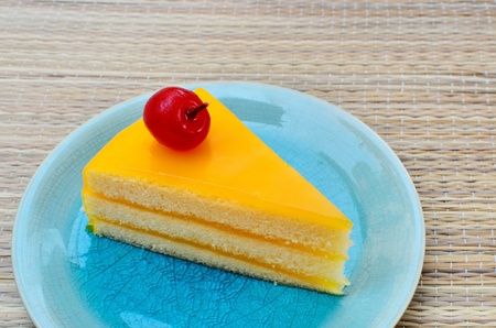 Orange cake in blue dish, Sweet dessertの写真素材