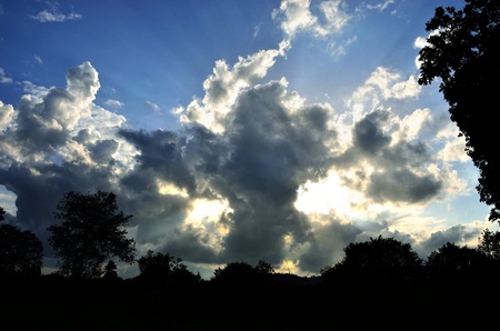 Sun beam shine through cloud in blue skyの写真素材