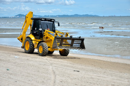 CHONBURI, THAILAND - JULY 15 : Local goverment use machinery cleaning Bangsaen beach on 15 July 2013...