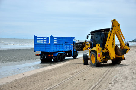 CHONBURI, THAILAND - JULY 15 : Local goverment use machinery cleaning Bangsaen beach on 15 July 2013 in the beach of Bangsaen, Chonburi, Thailandのeditorial素材