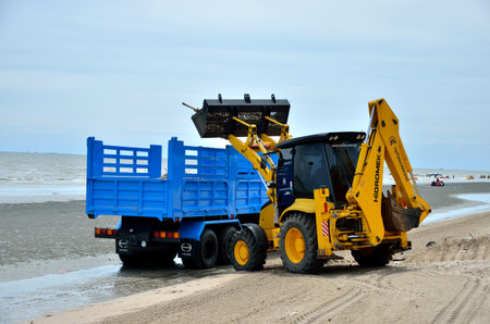 CHONBURI, THAILAND - JULY 15 : Local goverment use machinery cleaning Bangsaen beach on 15 July 2013 in the beach of Bangsaen, Chonburi, Thailandのeditorial素材
