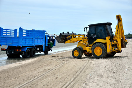 CHONBURI, THAILAND - JULY 15 : Local goverment use machinery cleaning Bangsaen beach on 15 July 2013 in the beach of Bangsaen, Chonburi, Thailandのeditorial素材