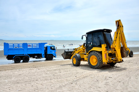 CHONBURI, THAILAND - JULY 15 : Local goverment use machinery cleaning Bangsaen beach on 15 July 2013 in the beach of Bangsaen, Chonburi, Thailandのeditorial素材