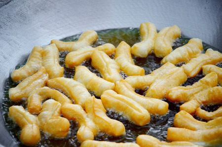 Deep-fried dough stick in hot oil, Chinese dessert