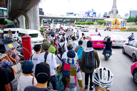 BANGKOK, THAILAND - SEPTEMBER 22   People walking for against the construction of a dam in Mae Wong National Park on 22 September 2013 at Victory monument, Bangkok, Thailandのeditorial素材