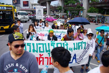 BANGKOK, THAILAND - SEPTEMBER 22   People walking for against the construction of a dam in Mae Wong National Park on 22 September 2013 at Victory monument, Bangkok, Thailandのeditorial素材
