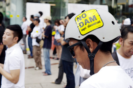BANGKOK, THAILAND - SEPTEMBER 22   Unidentified man with campaign sticker on helmet for against the construction of a dam in Mae Wong National Park on 22 September 2013 at Bangkok Art and Culture Centre, Thailandのeditorial素材