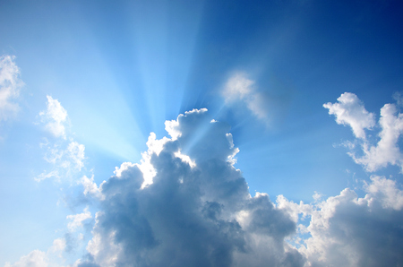 Nice sun beam shining through clouds skyの写真素材