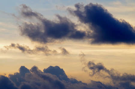 Black cloud with sunset skyの写真素材