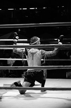 BANGKOK, THAILAND -  OCTOBER 9   Unidentified fighter first performs the respect Wai Khru Ram Muay  before fighing in MBK fight night on 9 October 2013 at MBK Center, Bangkok, Thailandのeditorial素材