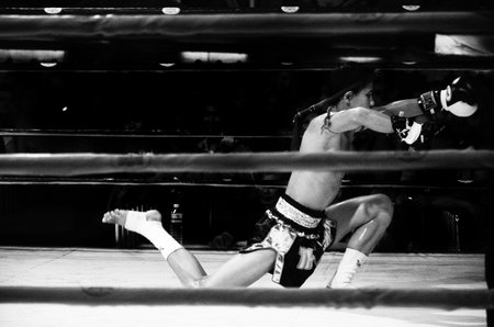 BANGKOK, THAILAND -  OCTOBER 9   Unidentified fighter first performs the respect Wai Khru Ram Muay  before fighing in MBK fight night on 9 October 2013 at MBK Center, Bangkok, Thailandのeditorial素材