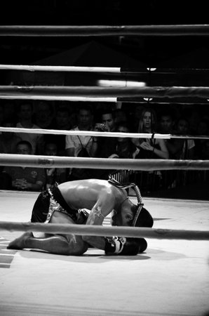 BANGKOK, THAILAND -  OCTOBER 9 : Unidentified fighter first performs the respect(Wai Khru Ram Muay) before fighing in MBK fight night on 9 October 2013 at MBK Center, Bangkok, Thailandのeditorial素材