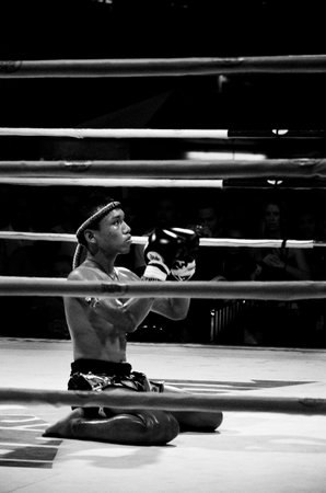 BANGKOK, THAILAND -  OCTOBER 9   Unidentified fighter first performs the respect Wai Khru Ram Muay  before fighing in MBK fight night on 9 October 2013 at MBK Center, Bangkok, Thailandのeditorial素材