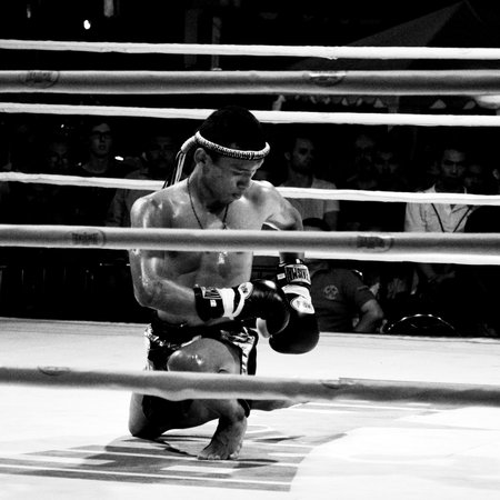 BANGKOK, THAILAND -  OCTOBER 9   Unidentified fighter first performs the respect Wai Khru Ram Muay  before fighing in MBK fight night on 9 October 2013 at MBK Center, Bangkok, Thailandのeditorial素材