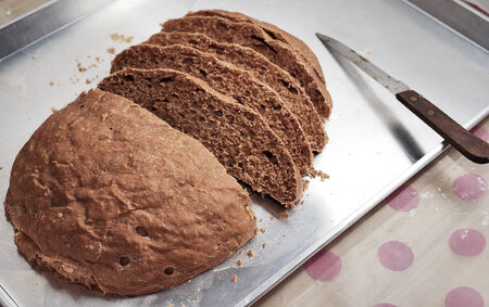 Nice homemade bread with knife for sliceの写真素材