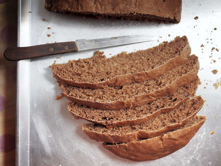 Nice homemade bread with knife for sliceの写真素材
