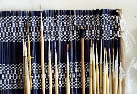 Paintbrush set on fabricの写真素材